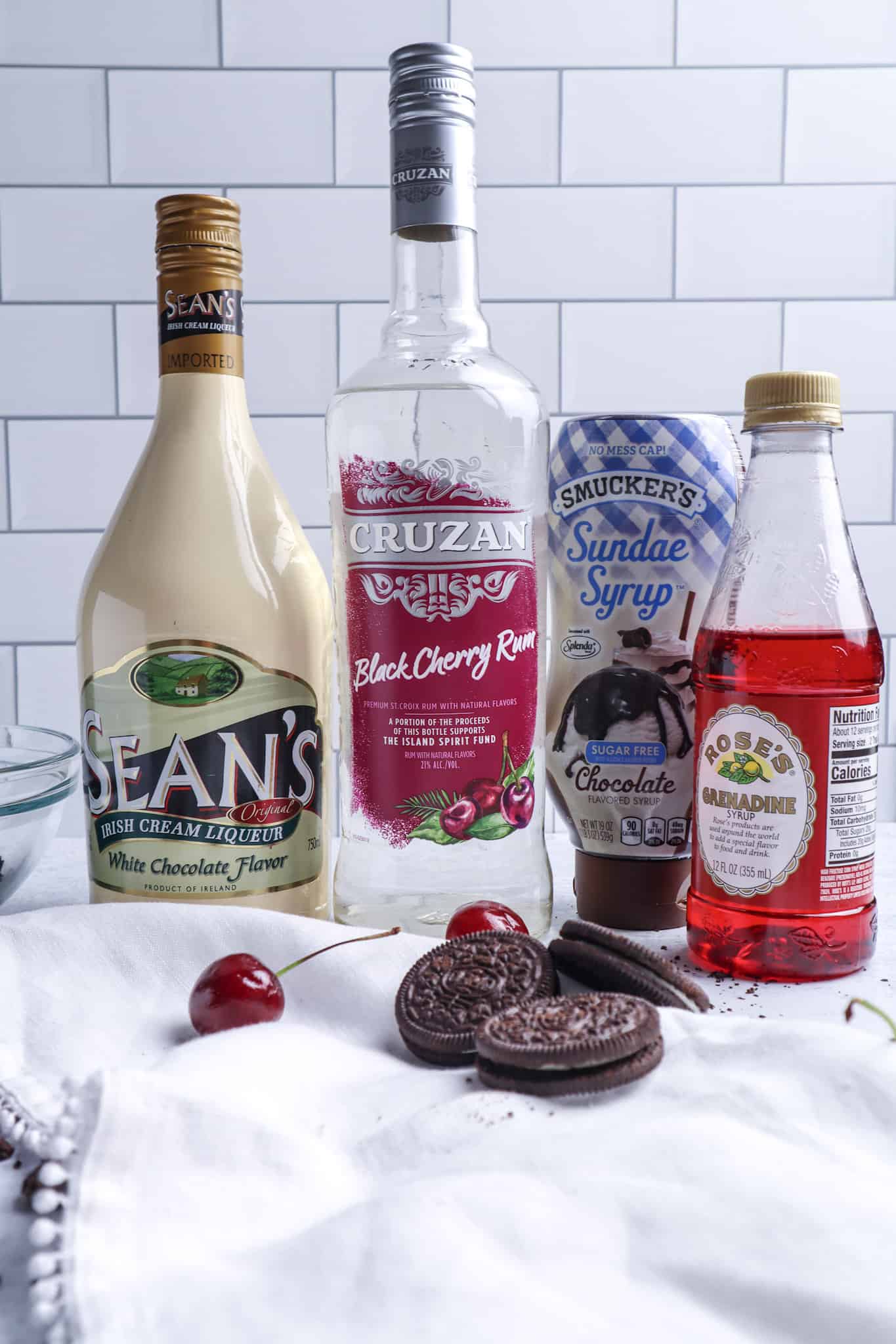 Ingredients need to make a Cherry Garcia Martini: White Chocolate Irish cream, Black Cherry Rum, Grenadine, Chocolate Syrup.