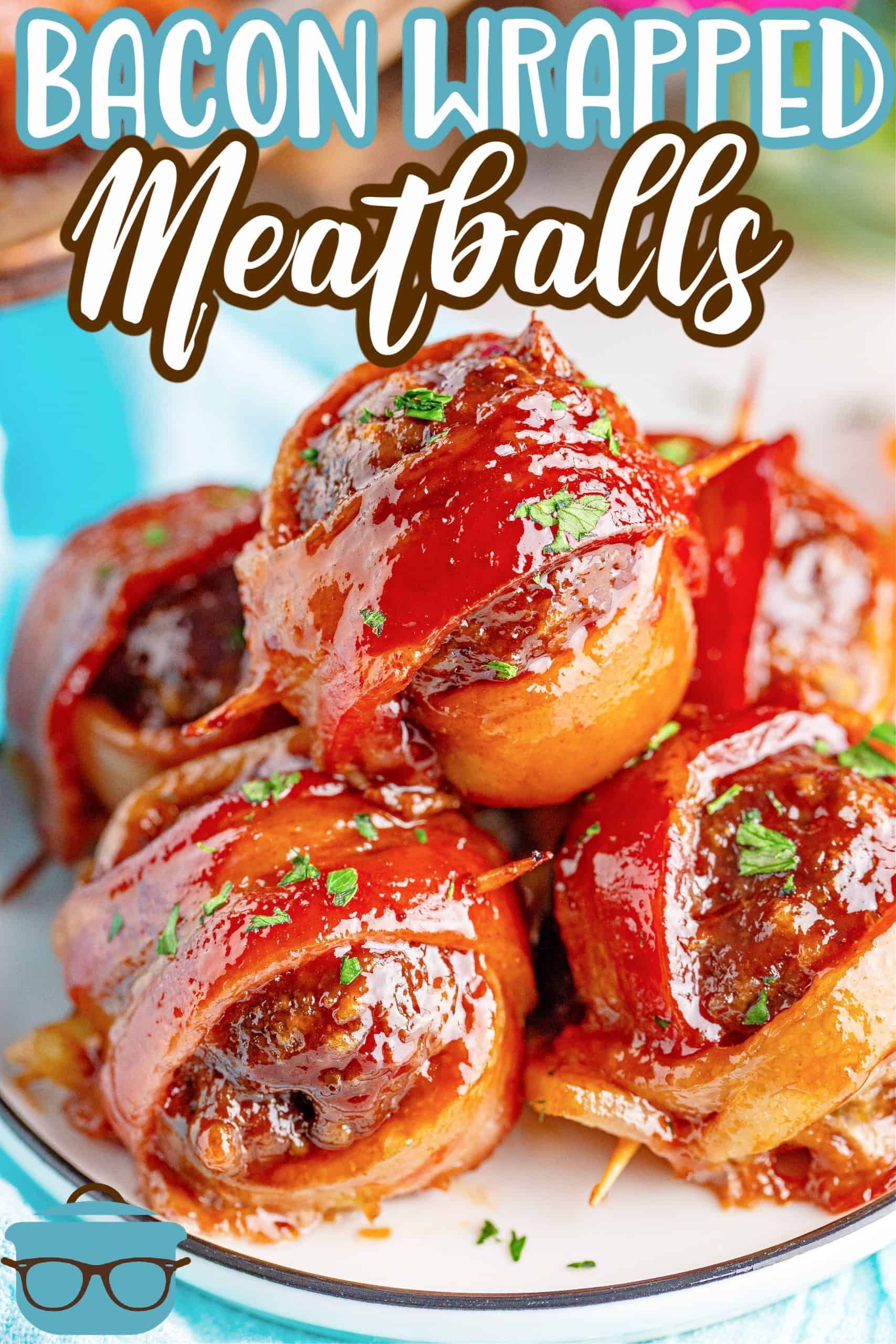 Stacked Bacon Wrapped Meatballs on a small round white plate.