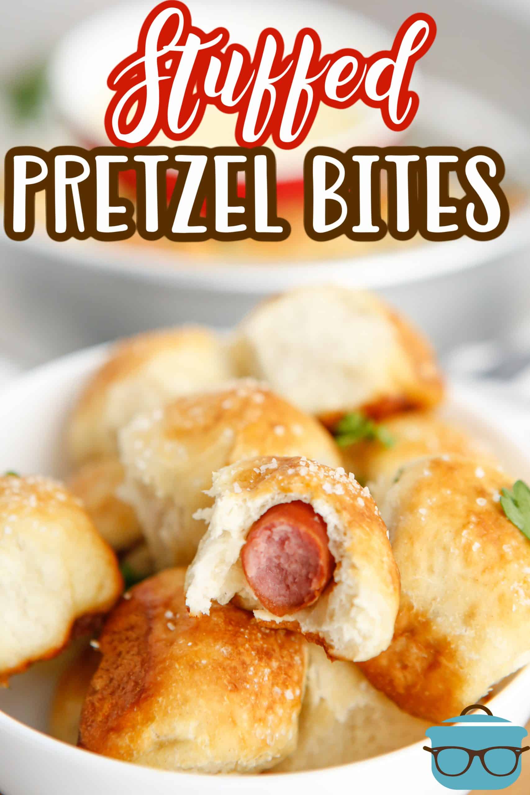 Stacked Stuffed Pretzel Bites in bowl with one with bite taken out.