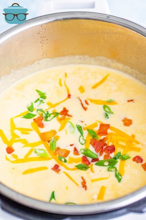 Finished Loaded Potato Soup topped with cheese, bacon and green onions