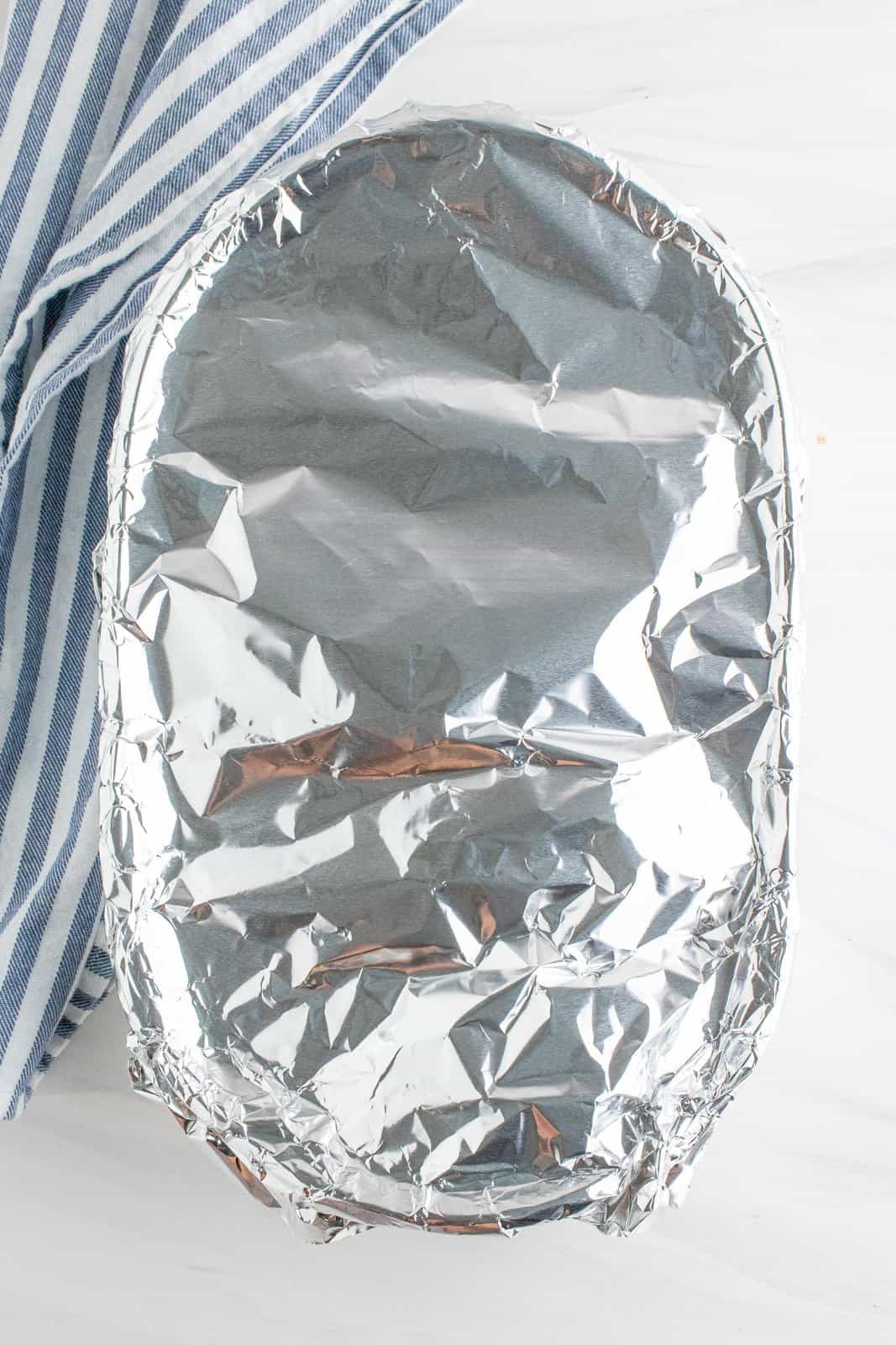 baking dish shown covered in aluminum foil. 