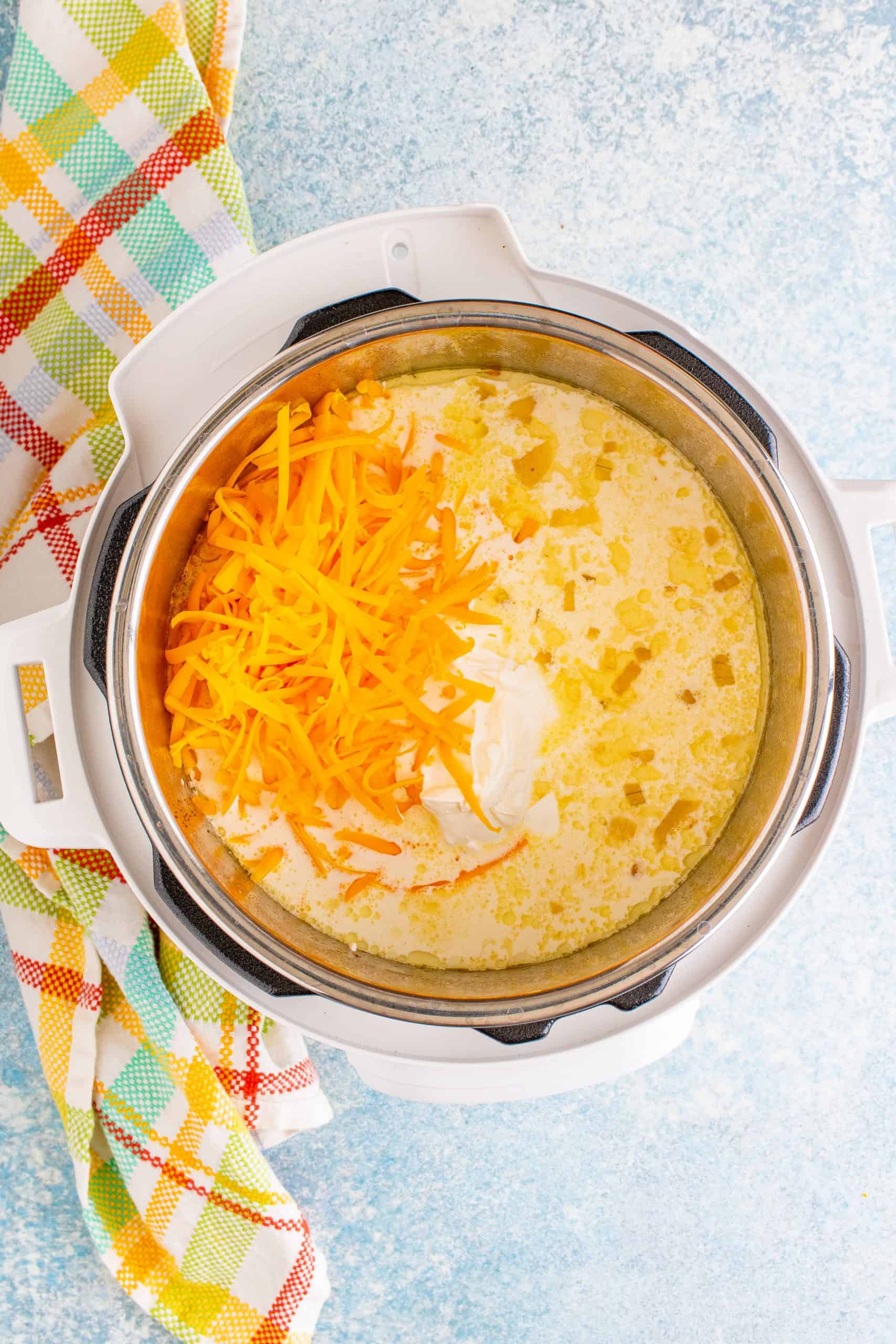 Cheese, sour cream and heavy cream added to instant pot.