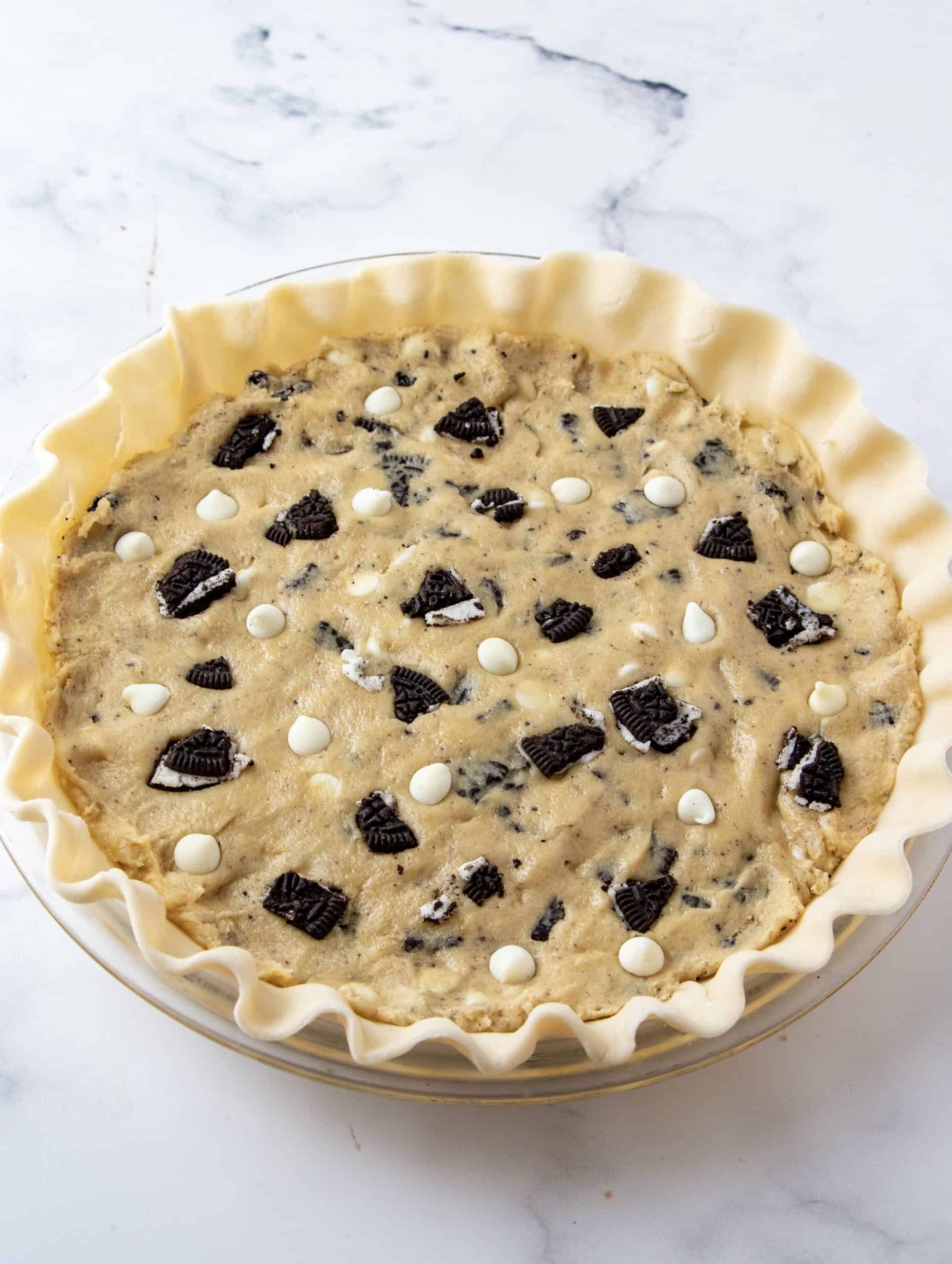 Oreo Cookie Pie filling added to pie crust.