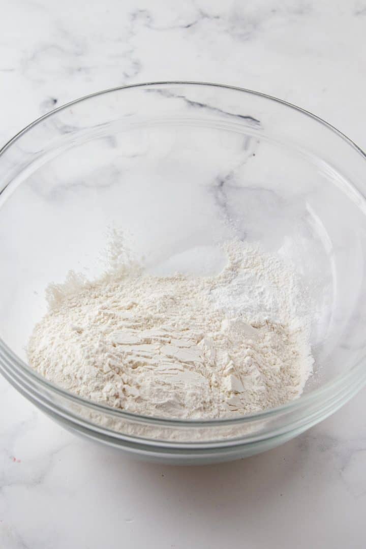 Flour, baking powder and salt in bowl