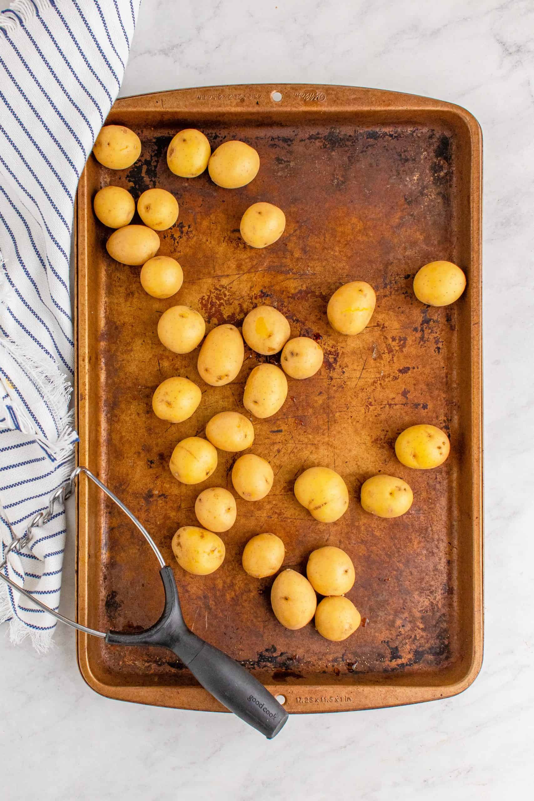 Potatoes on a copper sheet pan.