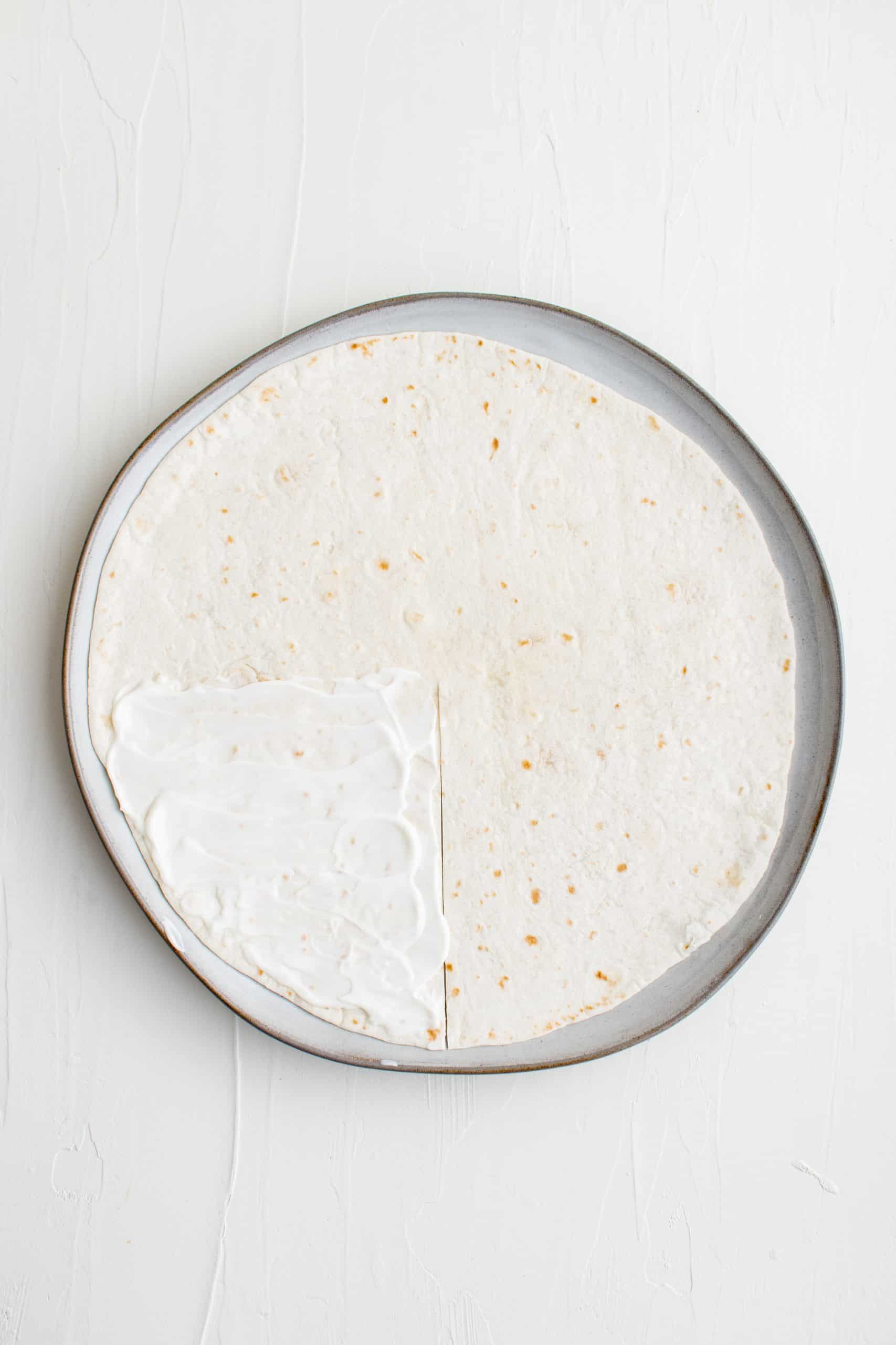 Tortilla on plate with slit cut in it.