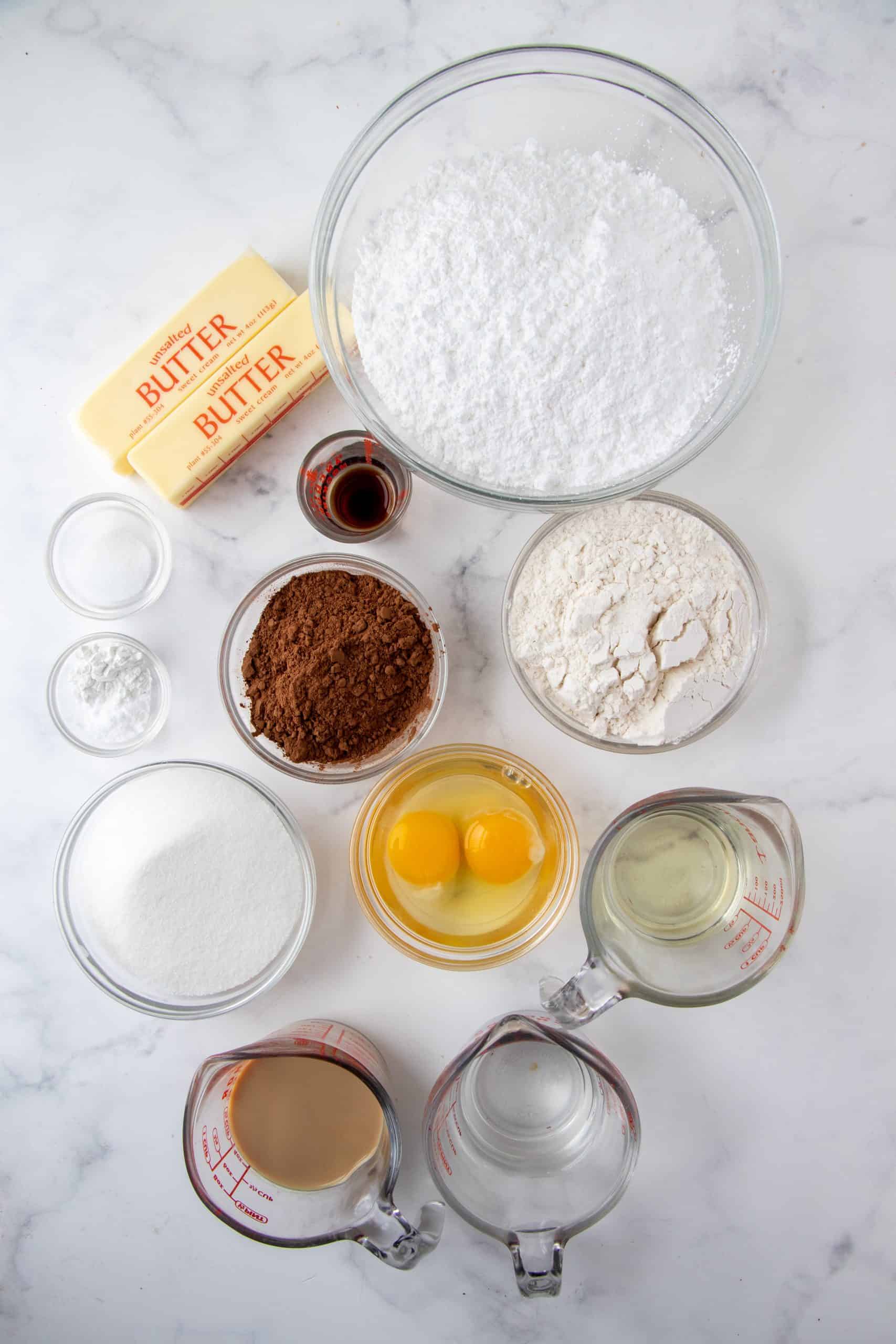 Ingredients need to make Homemade Baileys Cupcakes: all-purpose flour, sugar, cocoa powder, baking powder, baking soda, salt, vanilla extract, eggs, Baileys Irish Cream, water, oil, butter, powdered sugar.