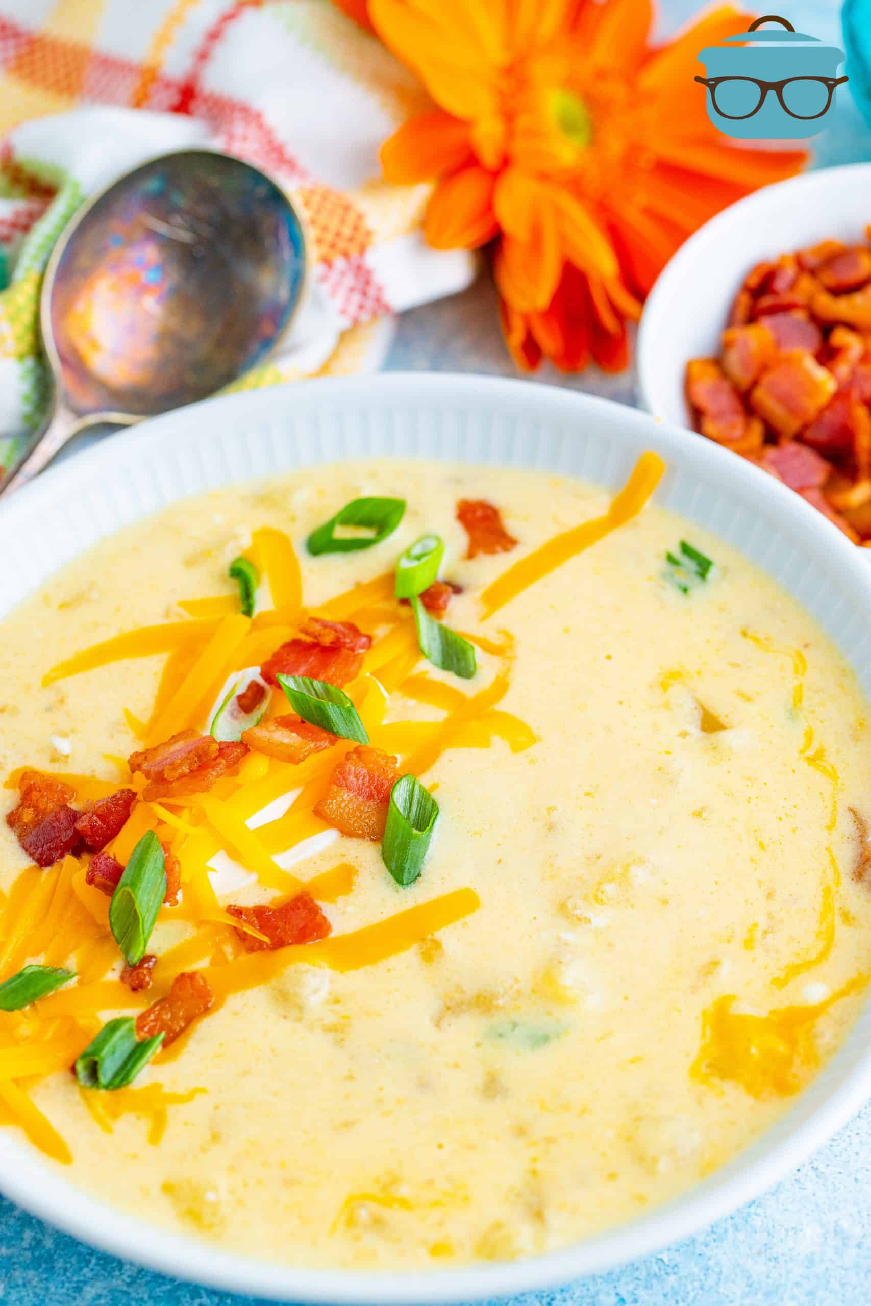 loaded potato soup shown served in a white bowl. 