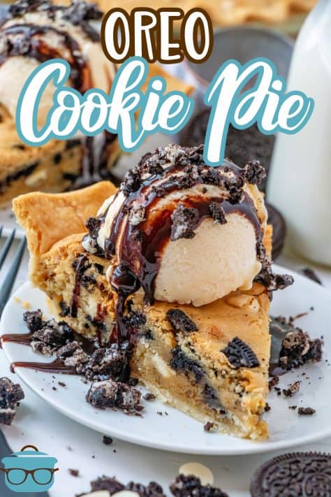 Slice of Oreo Cookie Pie on white plate with ice cream, chocolate syrup and Oreos Pinterest image