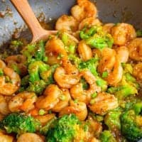Close up of Shrimp and Broccoli in pan with serving spoon square image