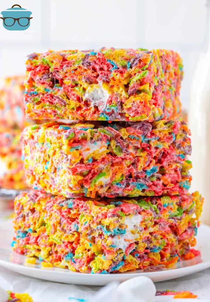 Three stacked Fruity Pebbles Treats on white plate