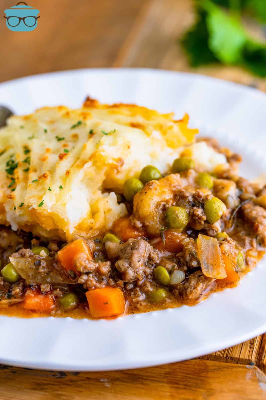 a white plate topped with a serving of Shepherd's Pie