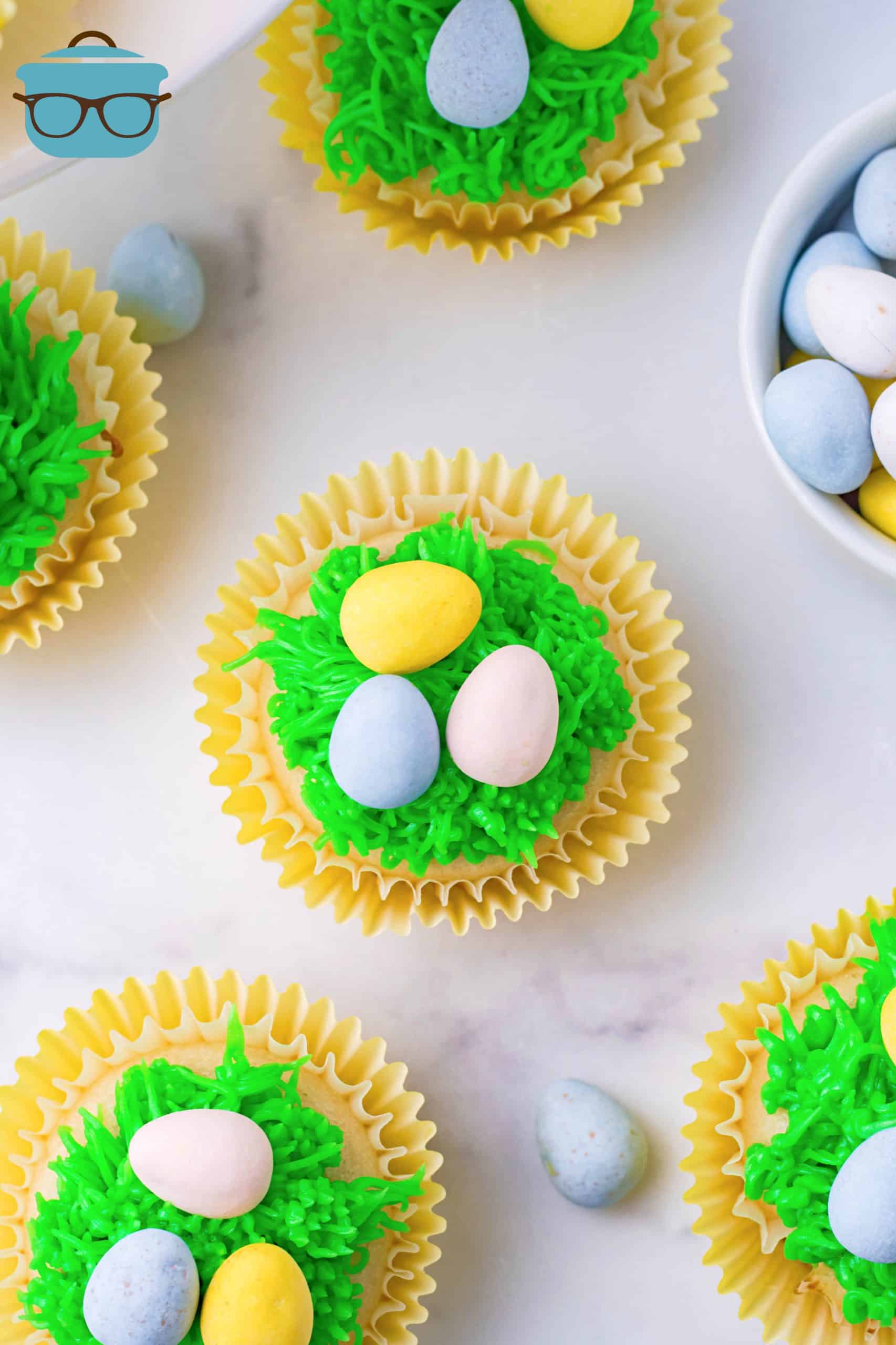 Overhead of Easter Egg Cupcakes on a marble surface.