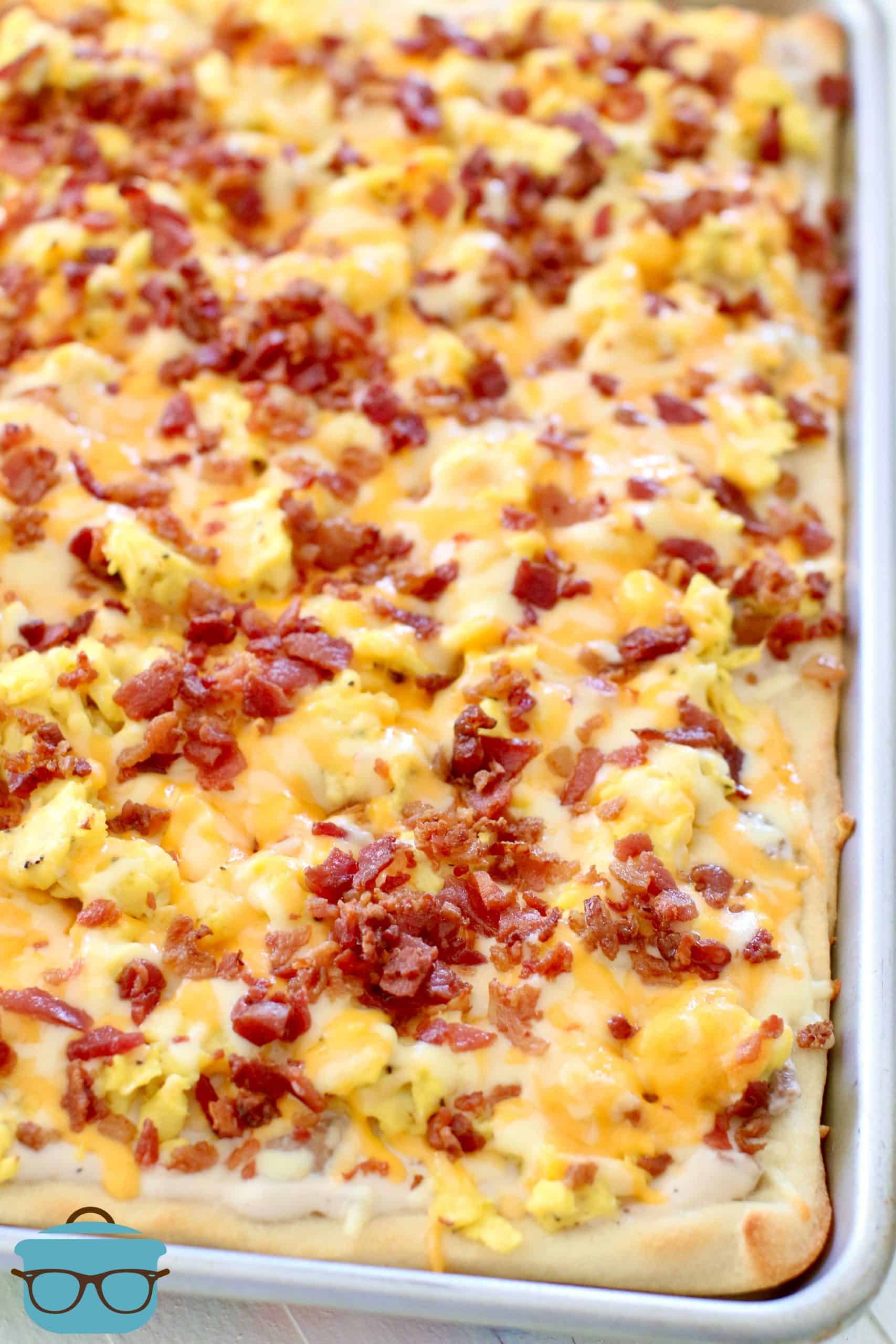 fully cooked breakfast pizza shown in baking pan.