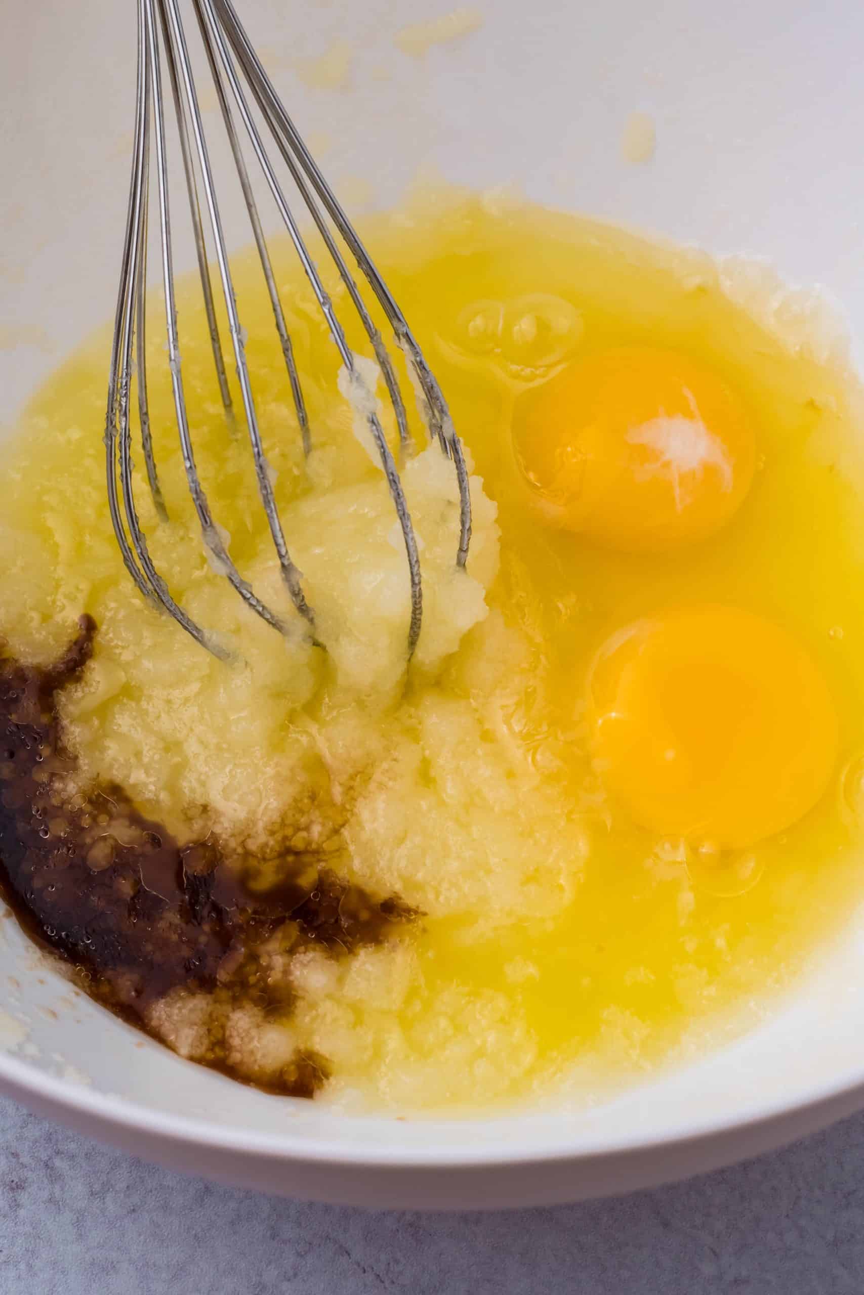 Eggs and vanilla added to sugar and eggs.