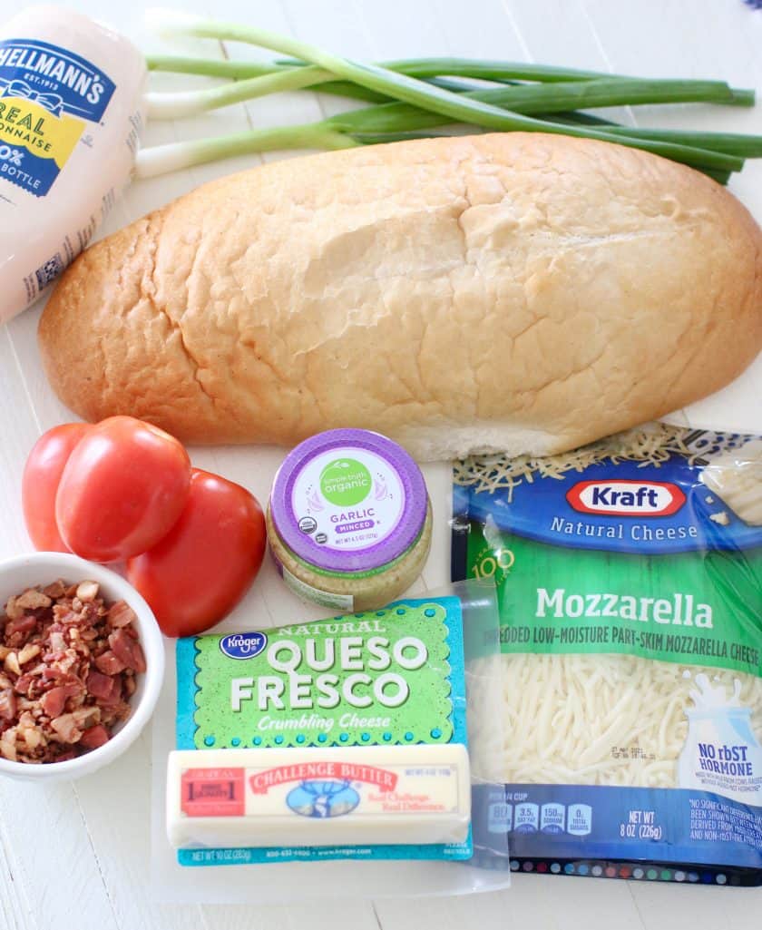 Florida Beach Bread ingredients: Italian Bread. salted butter, minced garlic, Roma tomatoes, queso fresco, shredded mozzarella cheese, mayonnaise, bacon pieces, green onions