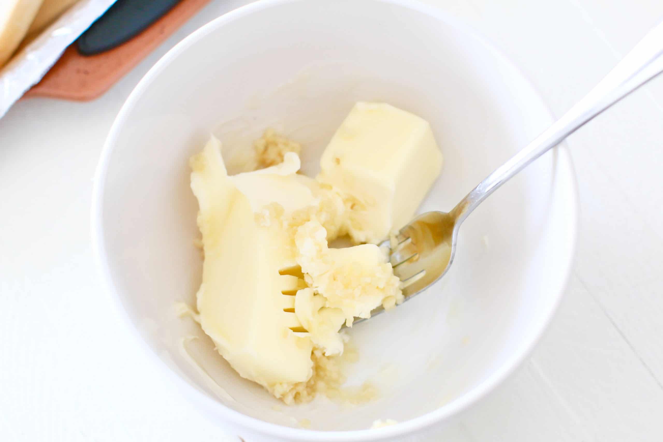softened butter and minced garlic in a bowl. 