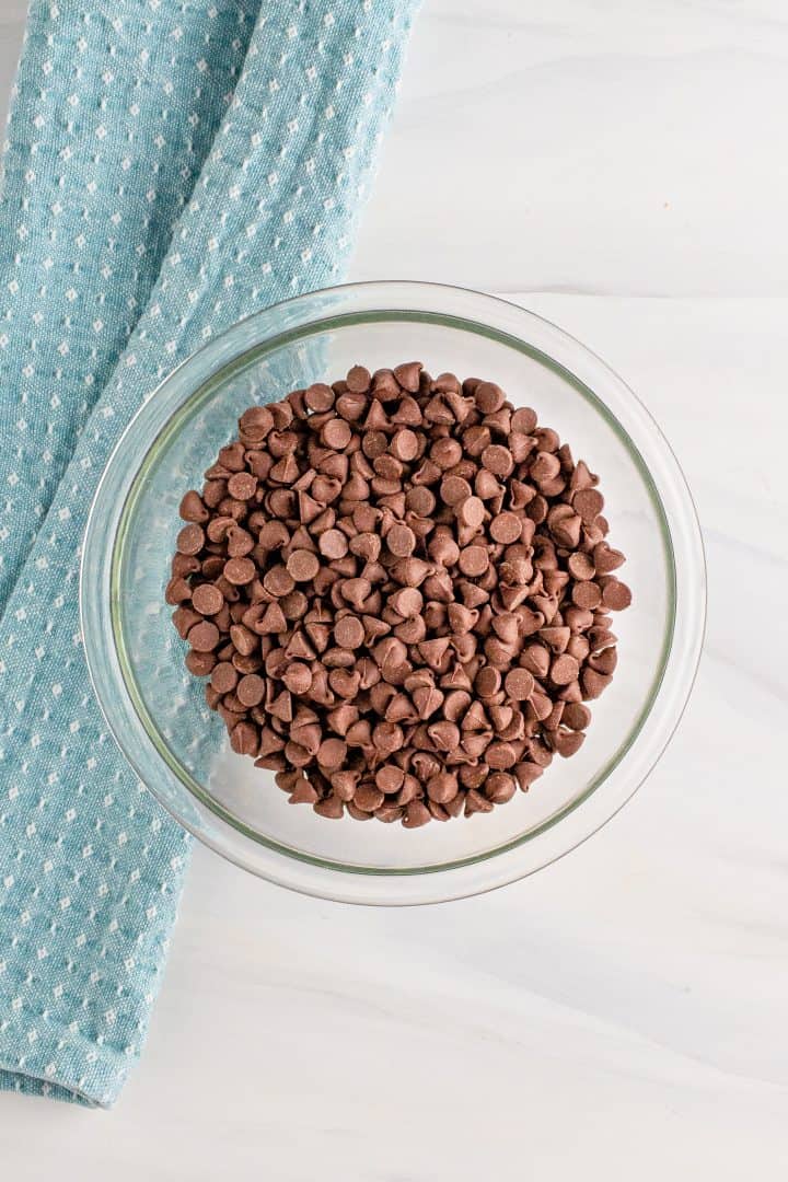 Chocolate chips in a clear bowl.