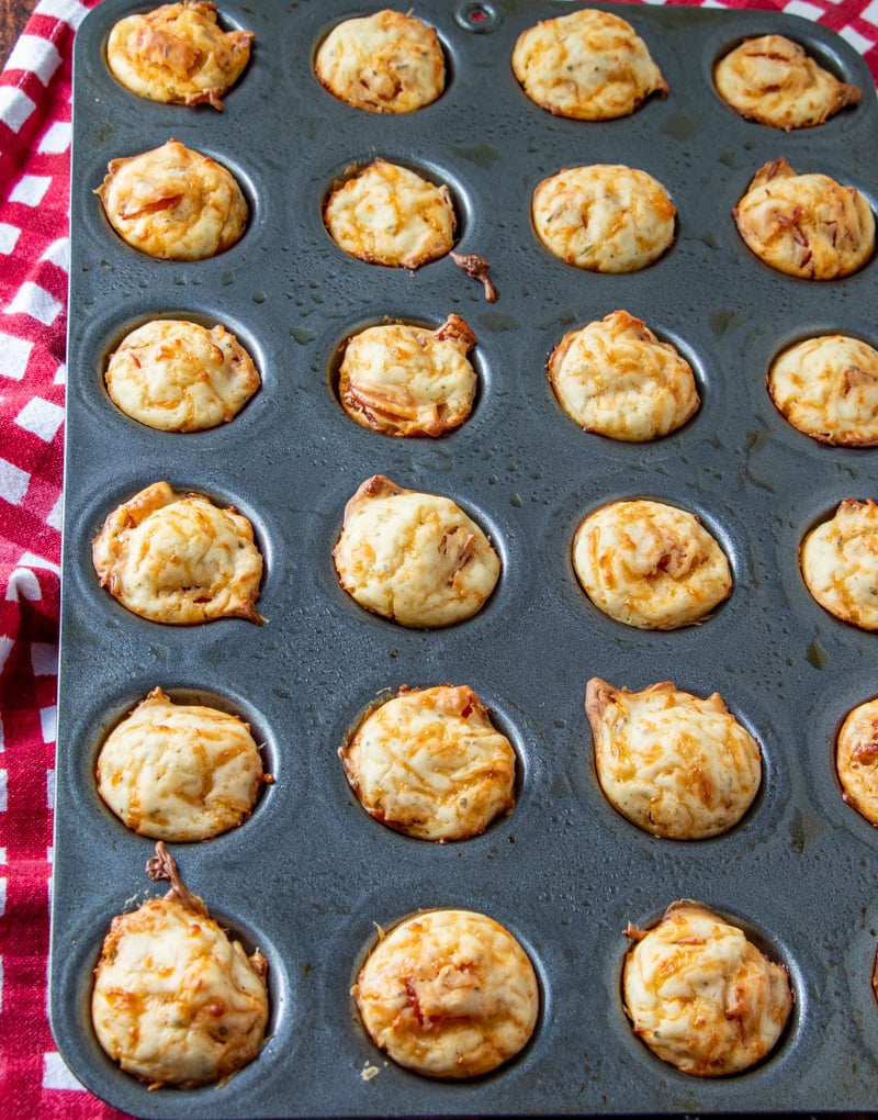 fully baked pepperoni puffs in a mini muffin tin.