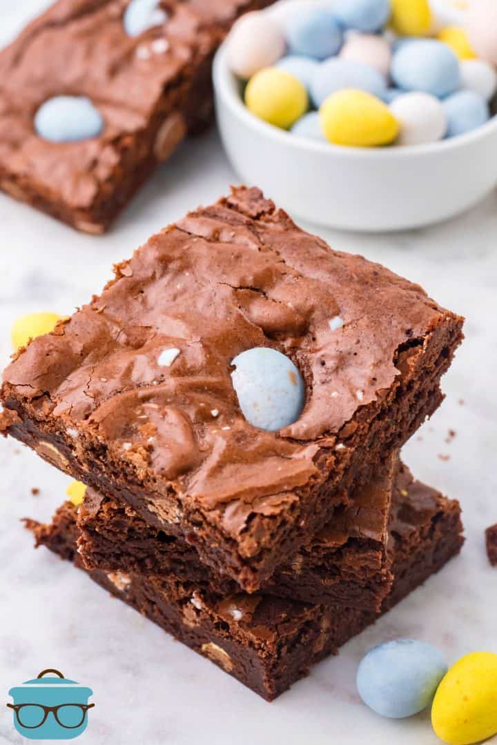 Three stacked Easter Egg Brownies on a marble surface.
