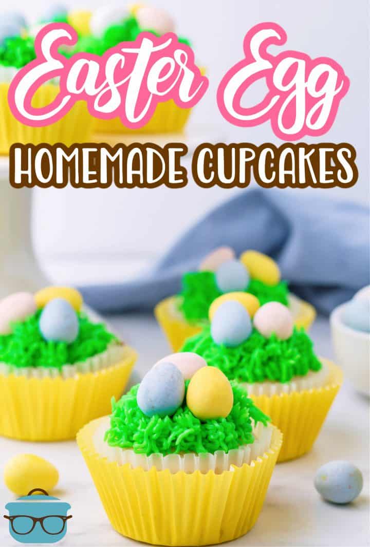 Multiple decorated Easter Egg Cupcakes on a marble surface.