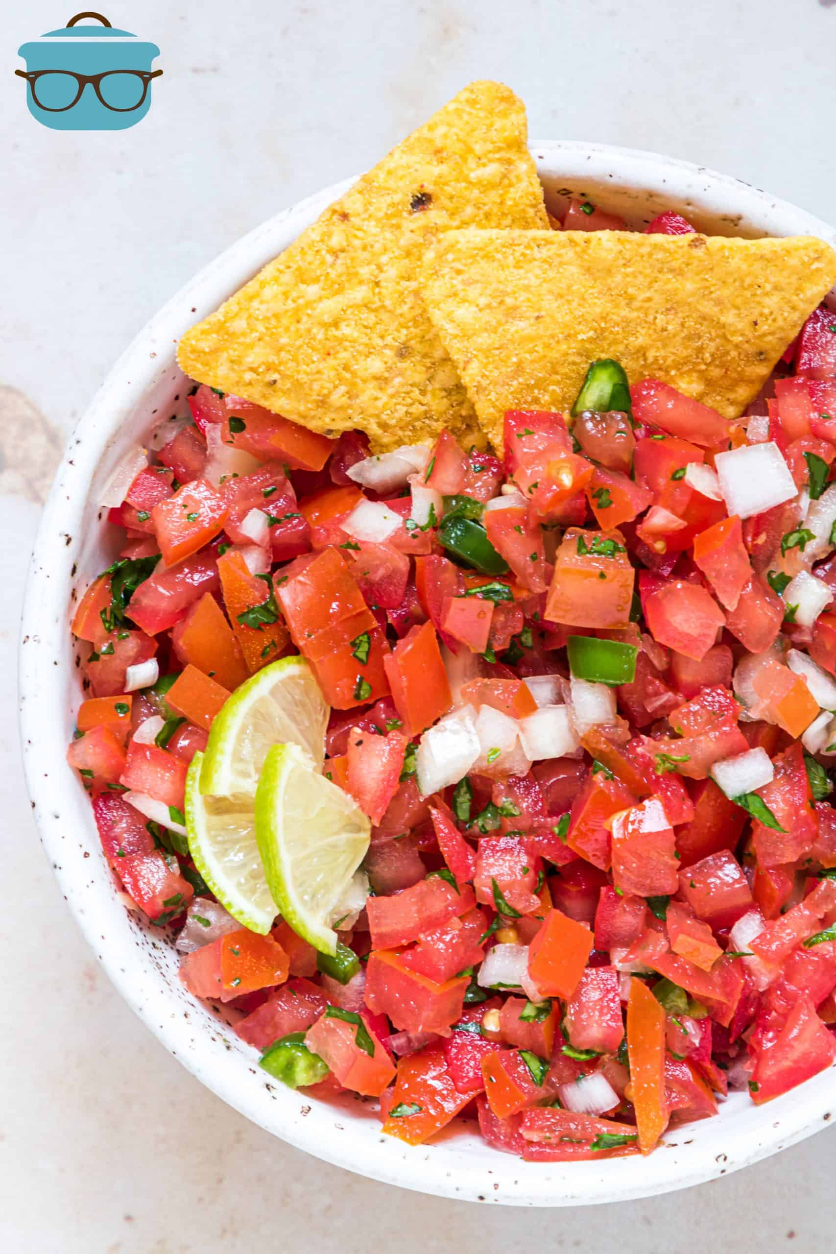 Overhead photo of Pico de Gallo in bowl with chips and lime