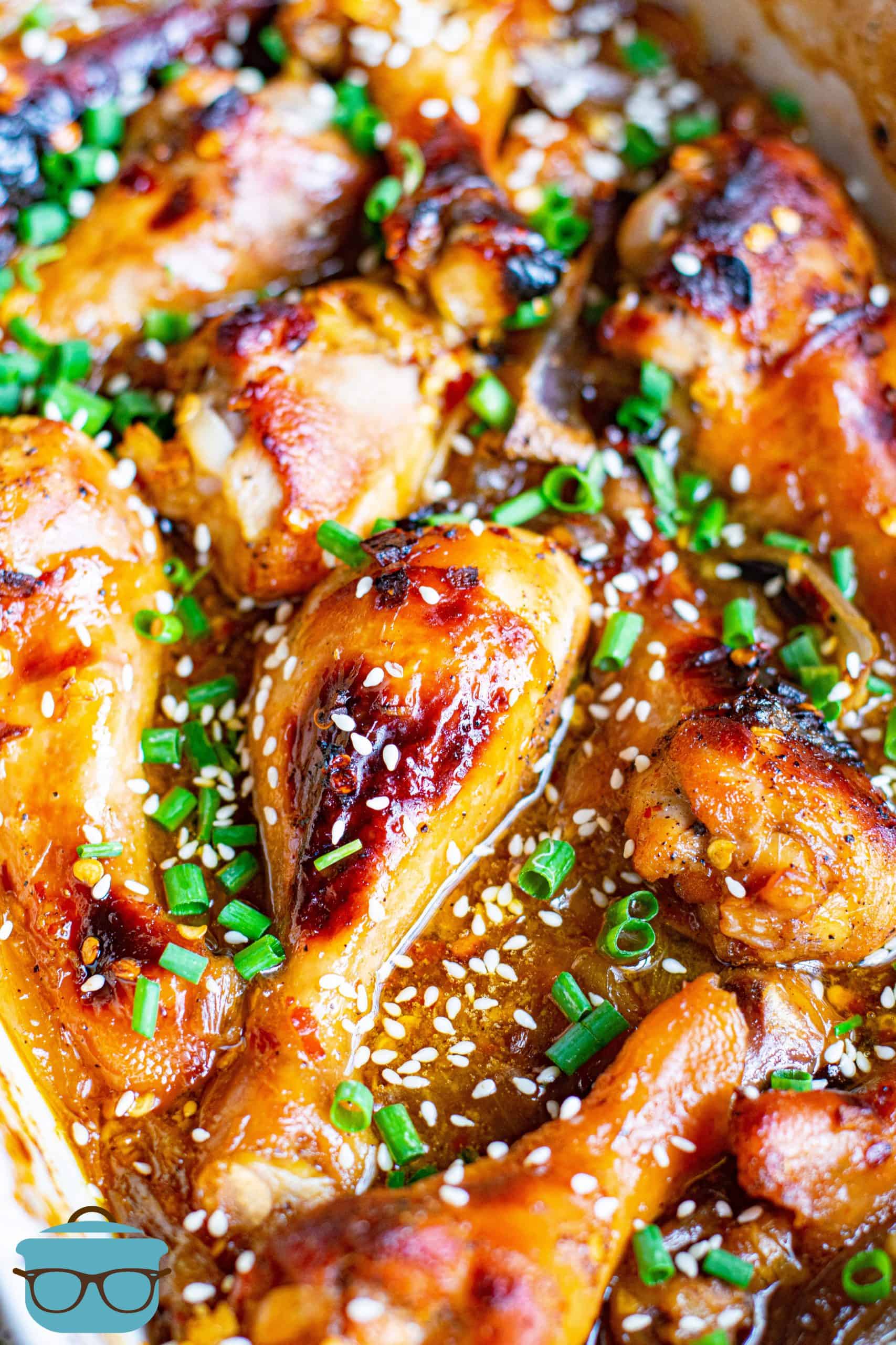 Close up overhead image of finished Honey Garlic Baked Drumsticks in pan.