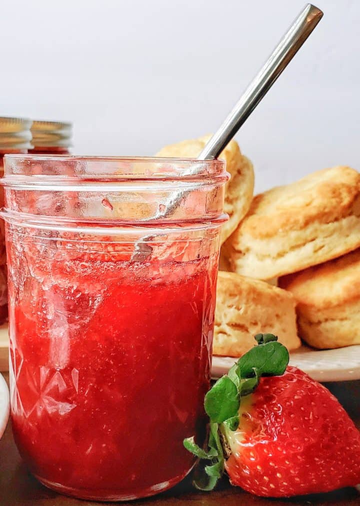 Strawberry Rhubarb Jam in jar with spoon 
