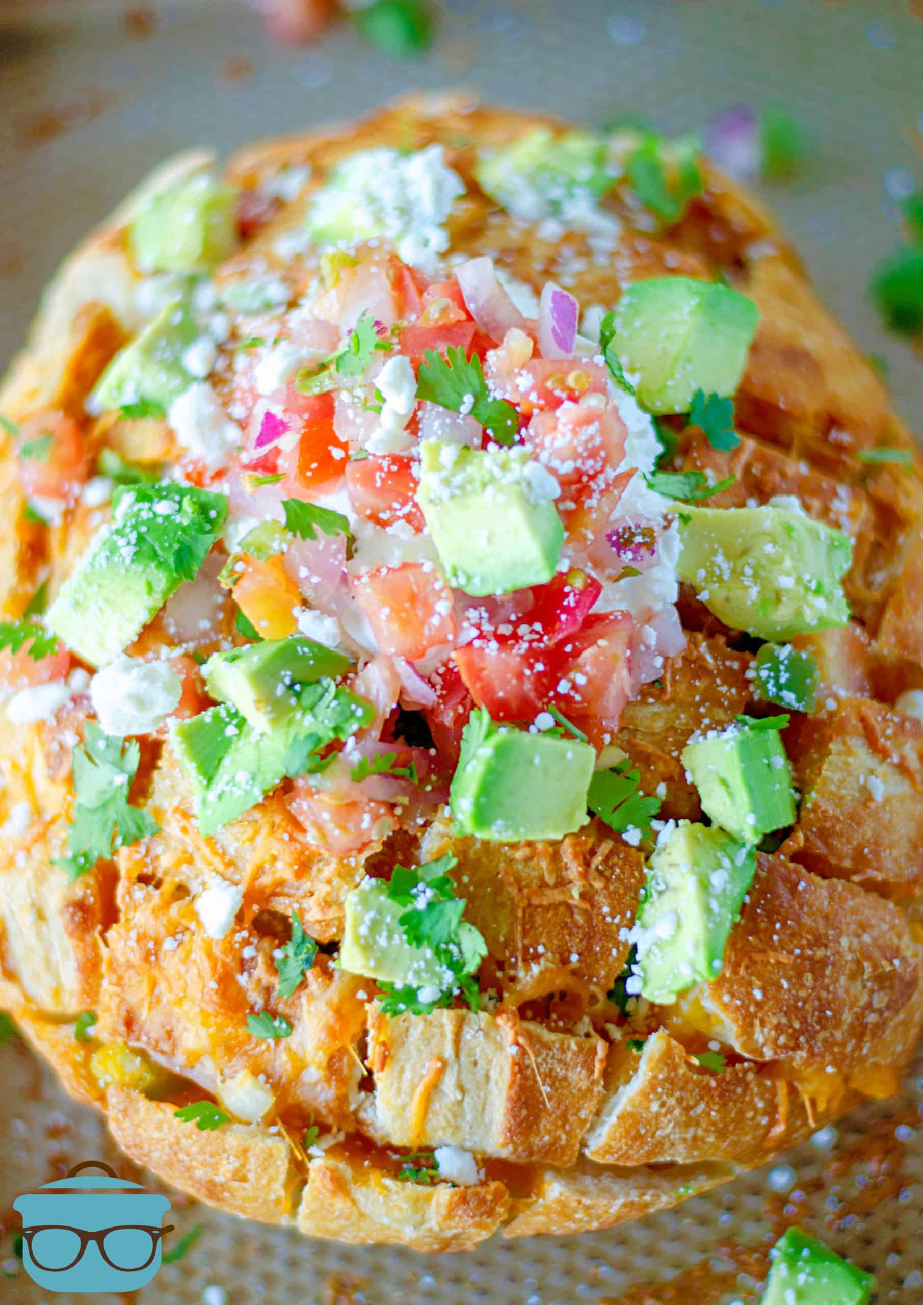 Finished Pull Apart Bread topped with taco toppings.