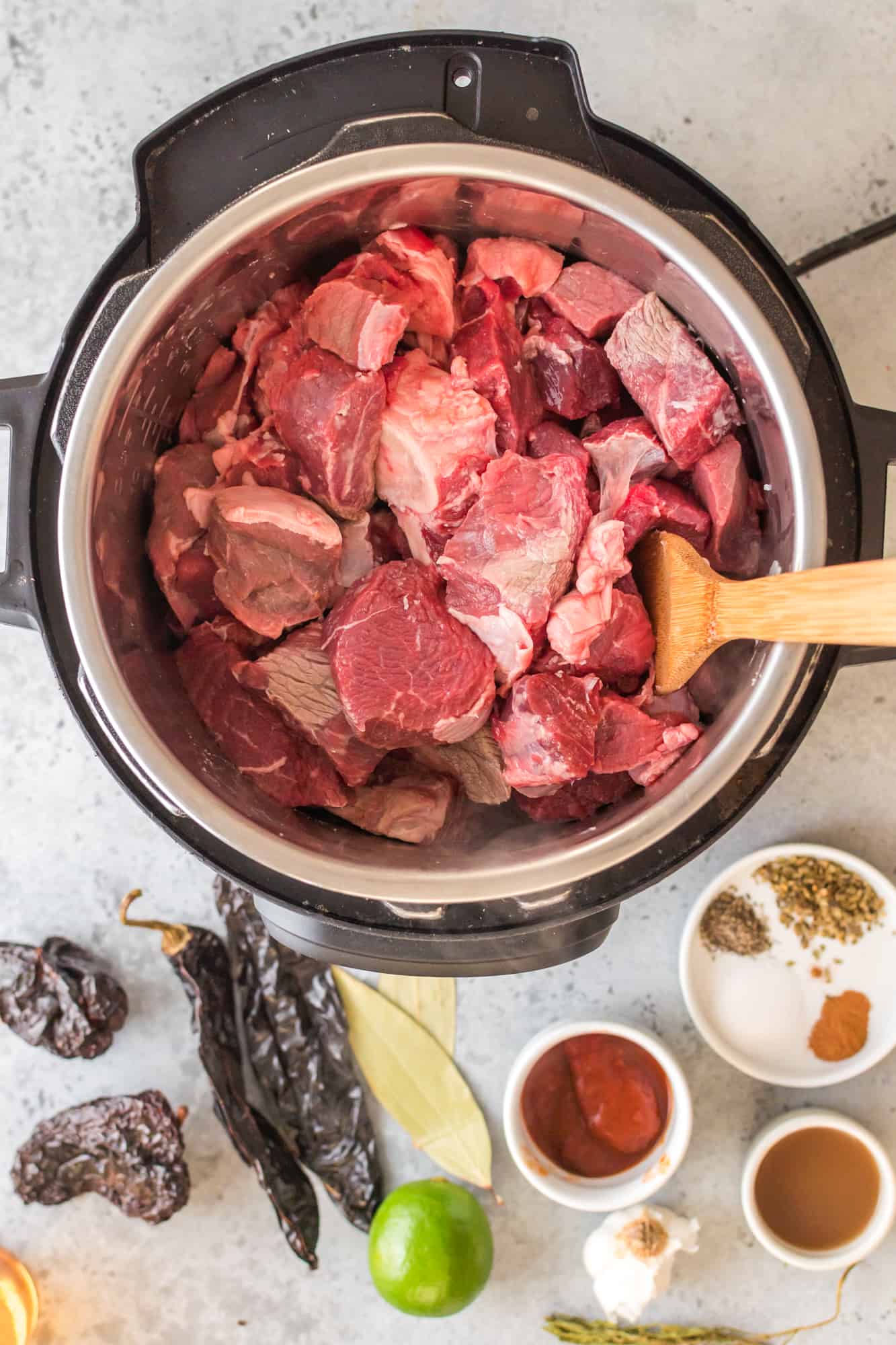 diced beef chunks placed in instant pot.
