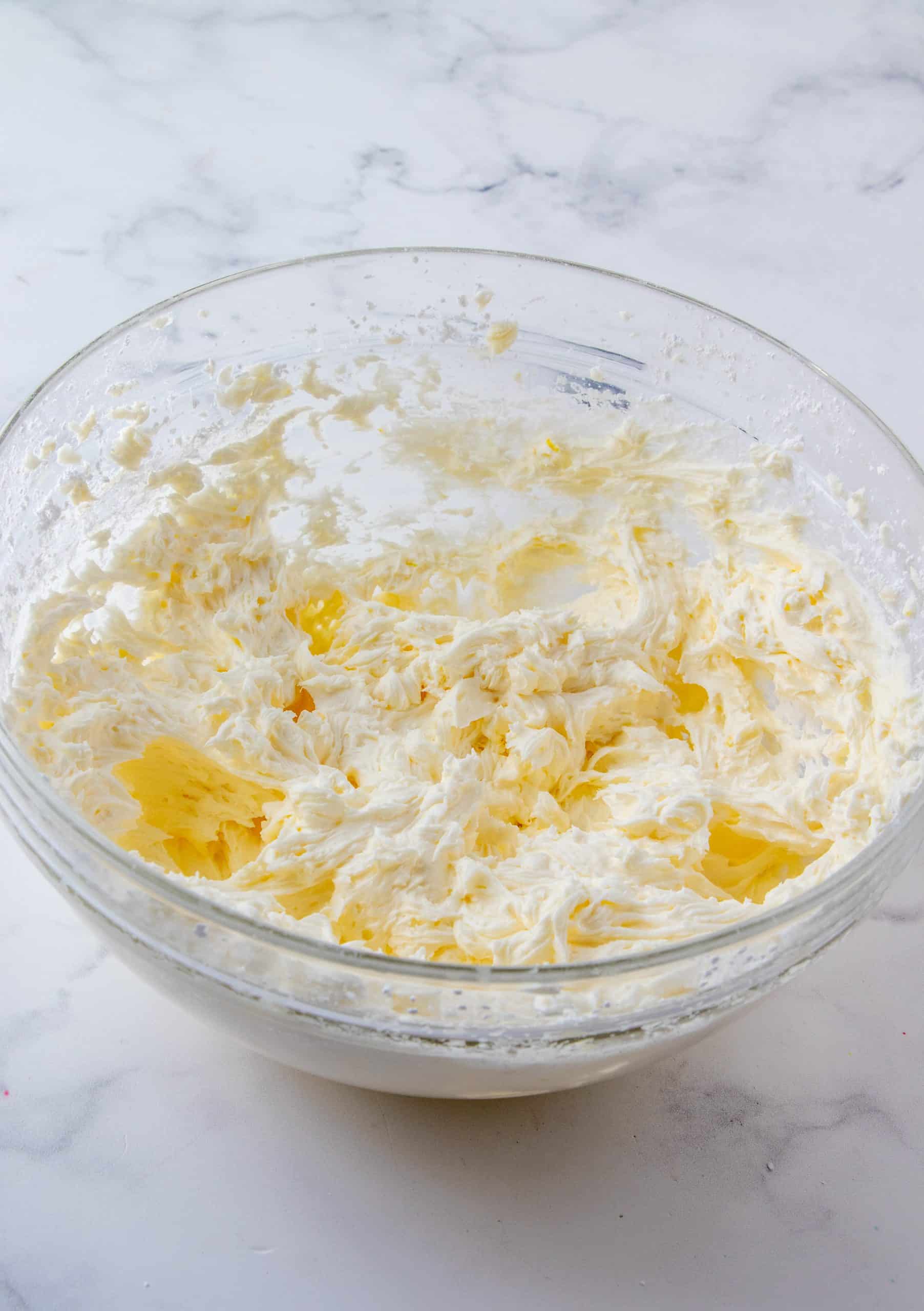 Finished lemon buttercream frosting in bowl.