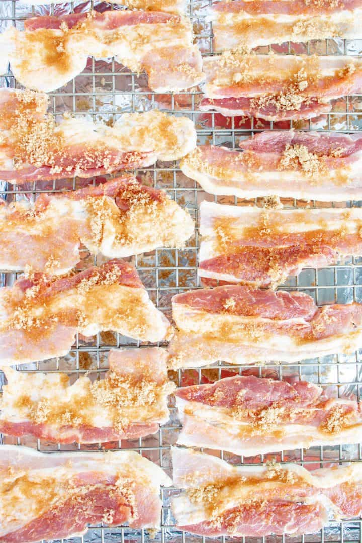 Cut bacon on wire rack over baking sheet sprinkled with brown sugar and pepper.