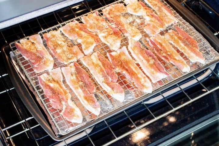 Pig Candy going into oven on a baking sheet.