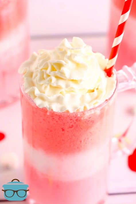 Finished Strawberry Cream Float topped with whipped cream close up