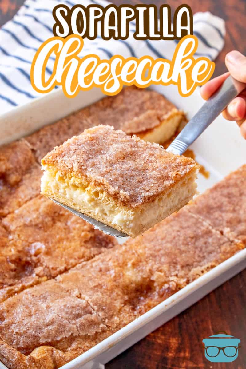 Sopapilla Cheesecake Bars recipe from The Country Cook, shown with a spatula removing one cheesecake bar from a baking pan