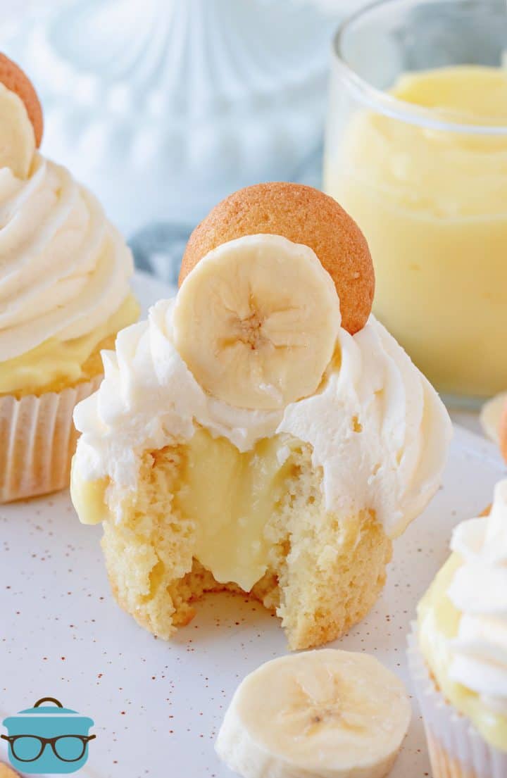 Banana Pudding Cupcake with bite taken out showing pudding inside cupcake.