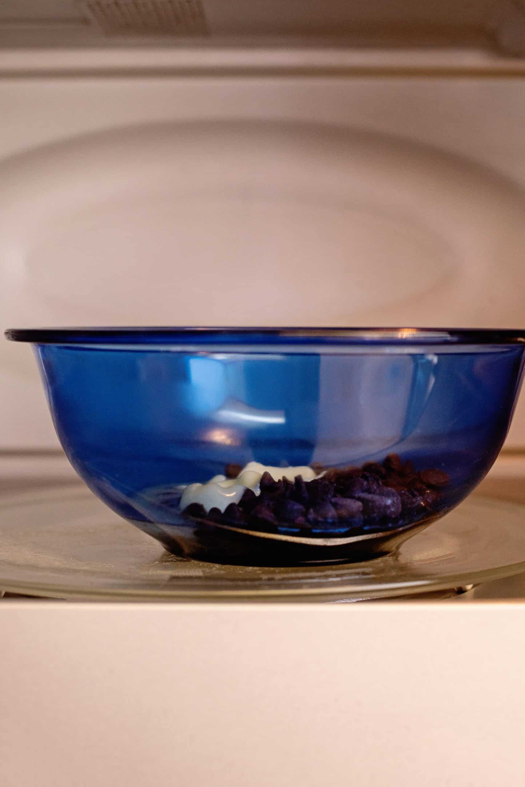 Chocolate ingredients added to bowl in microwave