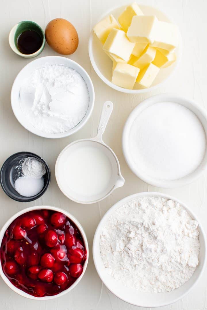 Ingredients needed: all-purpose flour, granulated sugar, baking powder, salt, butter, egg , vanilla extract, cherry pie filling, powdered sugar and milk.