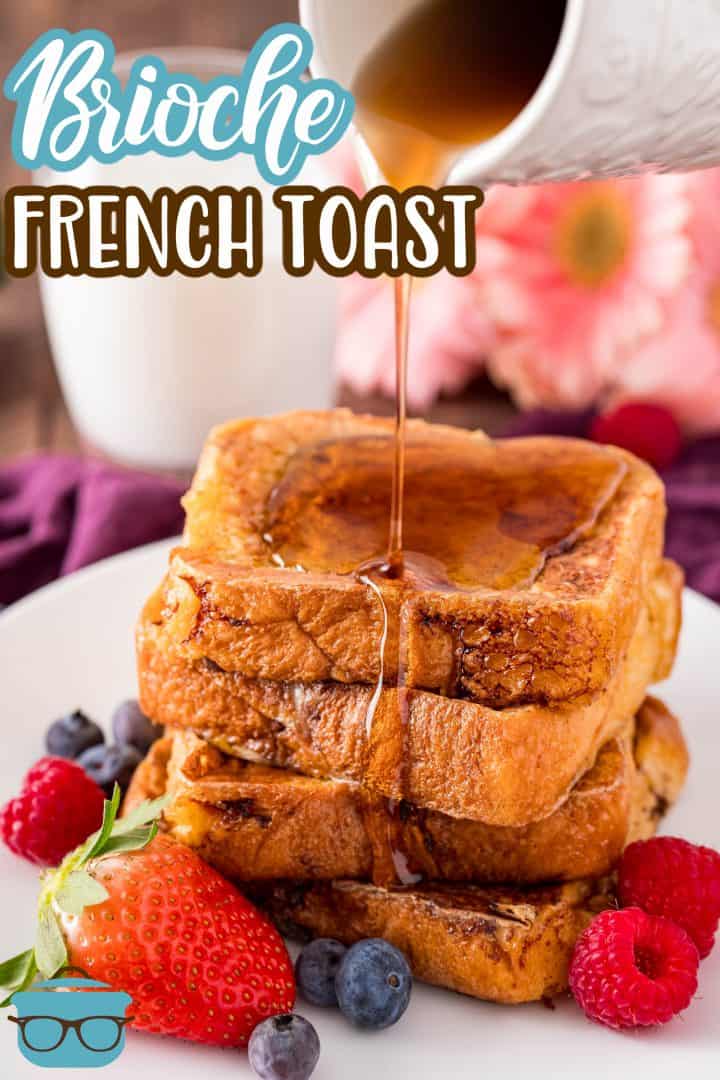 Stacked Brioche French Toast with syrup being poured over it on white plat with fruit Pinterest image.