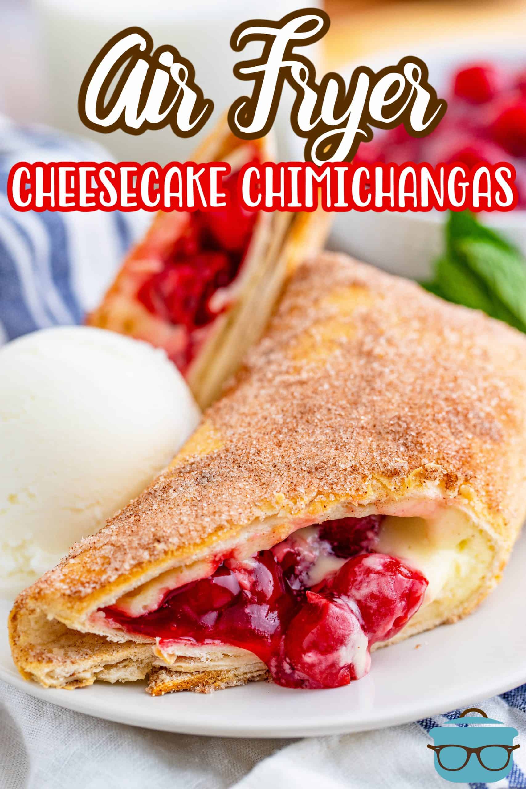 Close up of one cut open Air Fryer Cheesecake Chimichanga showing cherry cheesecake filling Pinterest image.