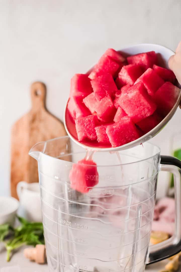Watermelon being added to blender
