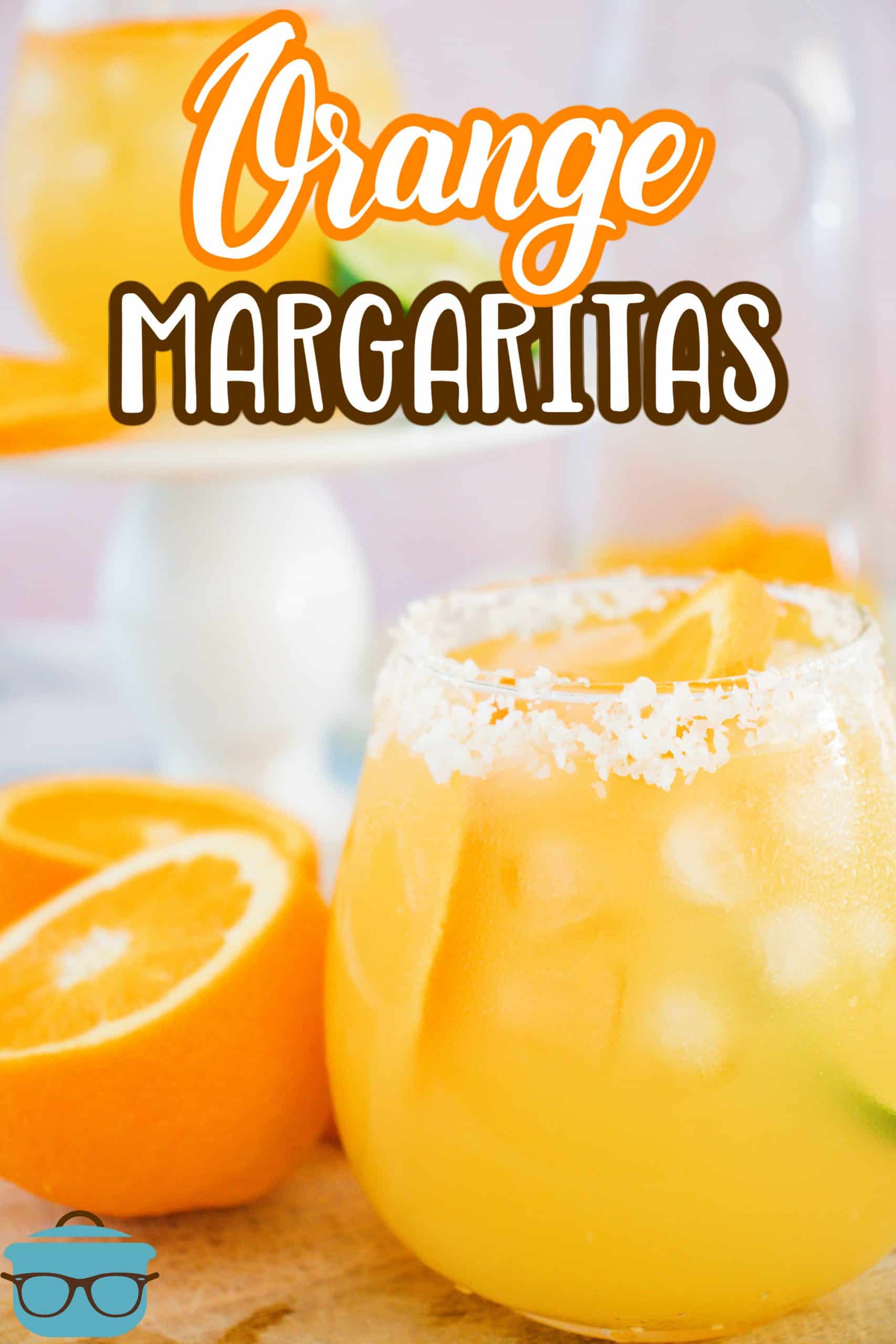 Garnished Orange Margaritas in glass with oranges around the outside Pinterest image.