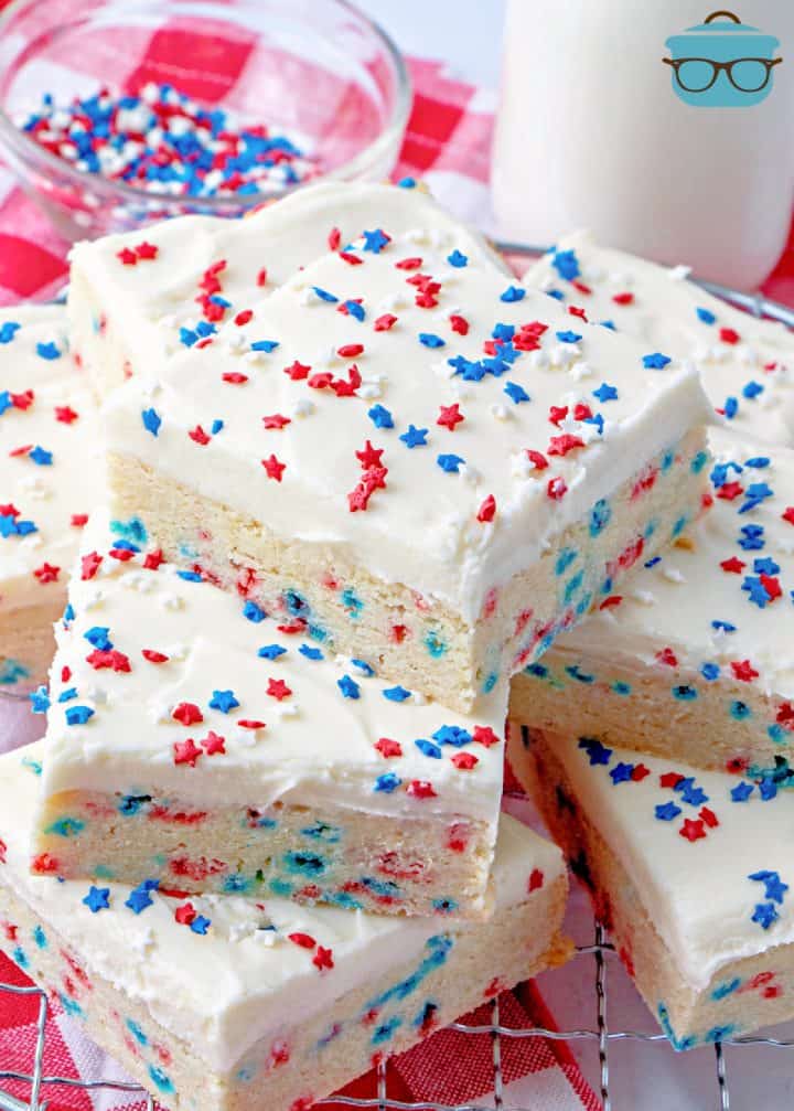 Stacked Patriotic Sugar Cookie Bars topped with star sprinkles