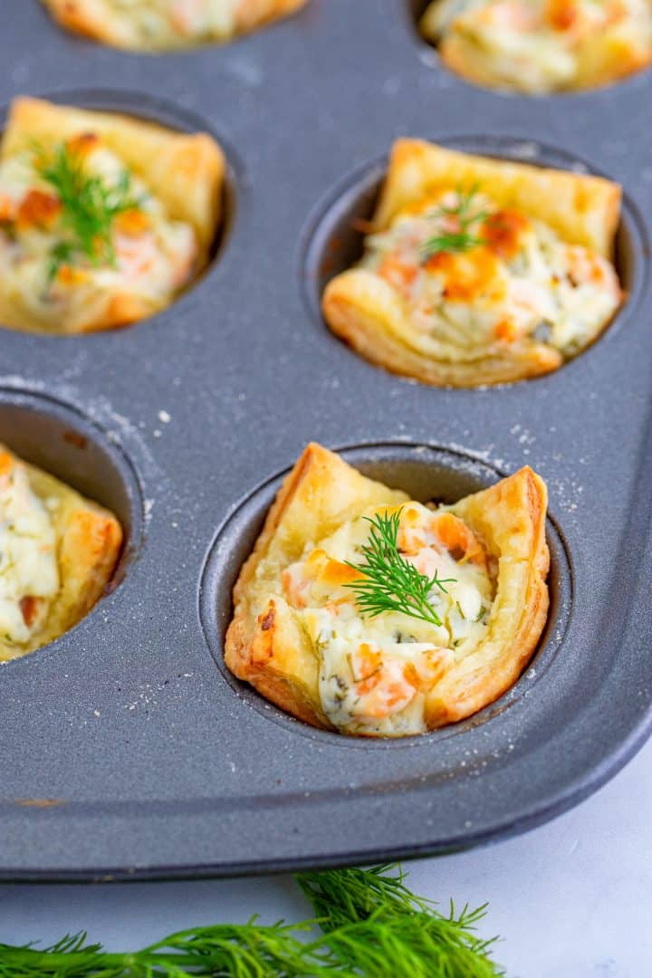 Close up of finished Smoked Salmon Puffed Pastry Bites in muffin tin