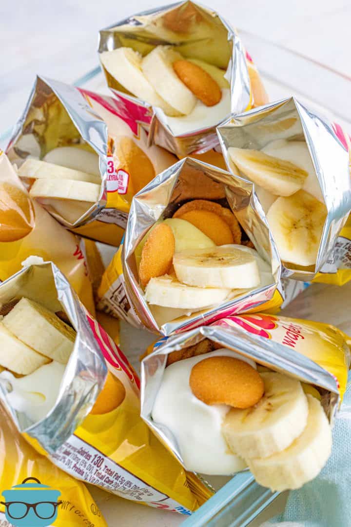Overhead of photo of multiple bags of Walking Banana Pudding in a glass dish