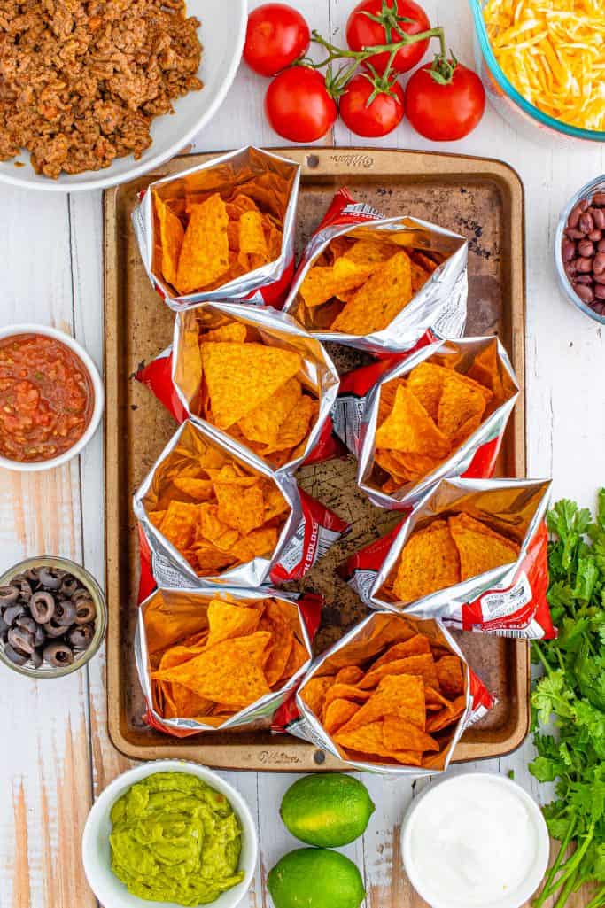 Open bags of Doritos on sheet pan