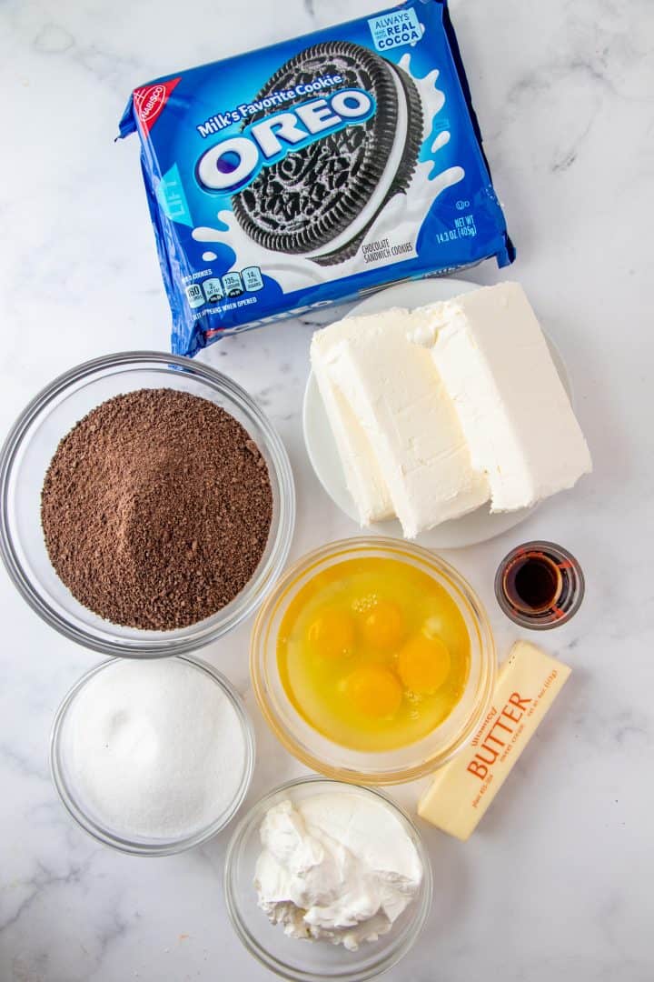 Ingredients needed: chocolate graham cracker crumbs, granulated sugar, unsalted butter, cream cheese, vanilla extract, eggs.