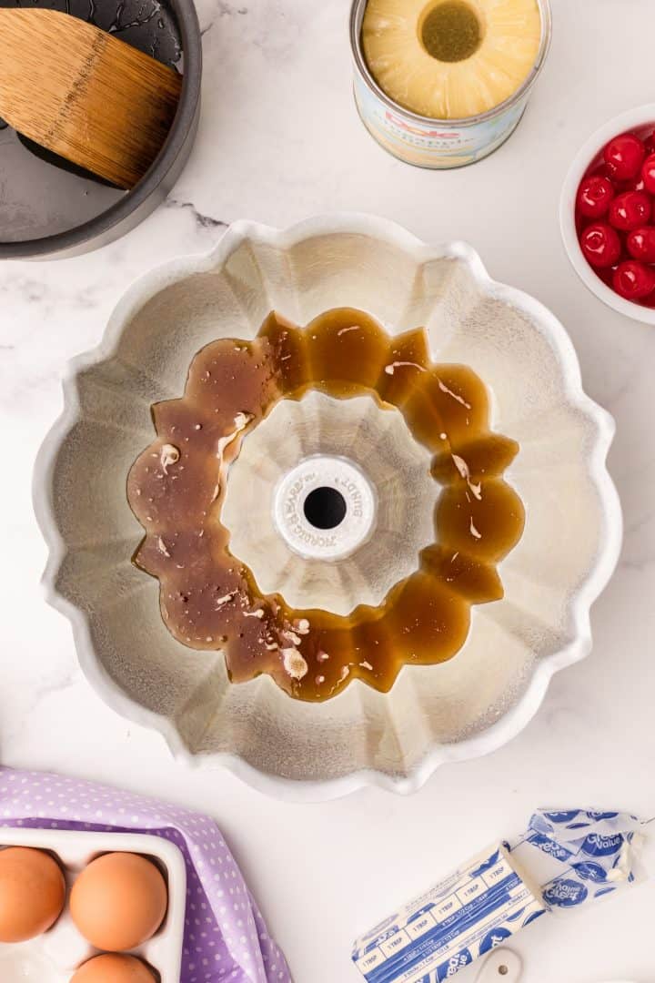 Melted brown sugar and butter in bottom of bundt pan