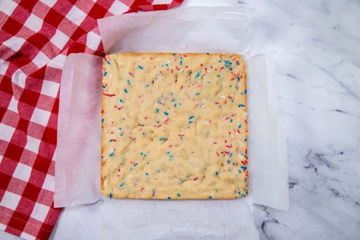 Finished Patriotic Sugar Cookie Bars out of pan on parchment paper cooling