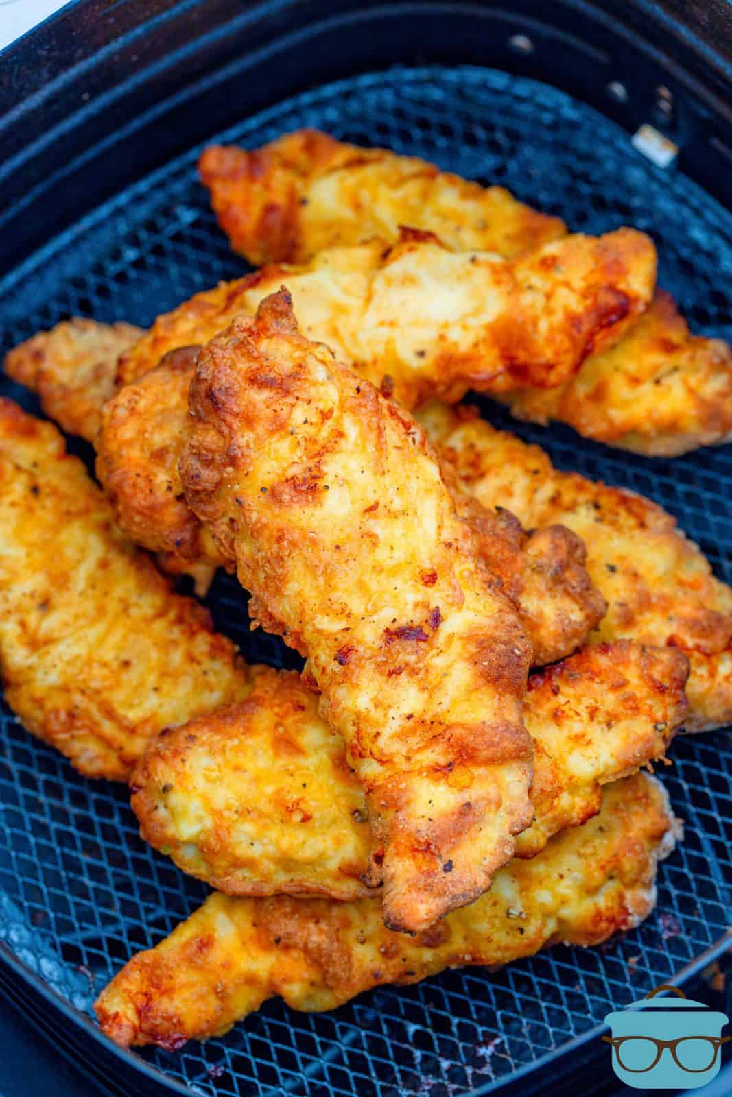 Air Fryer Chicken Crispers in air fryer basket after cooking.